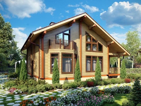 Finition de la façade d'un chalet en bois